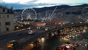 A busy highway with a Ferris wheel in the background.