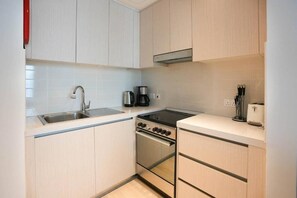 Apartment, Balcony, Canal View | Private kitchen - Bloomfields STU Canal View Waters Ed 1 (Abu Dhabi)