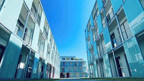 A modern building with a symmetrical facade, large windows, and a central entrance. - Wanderlust Trier (Trier)