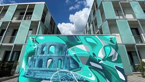 A modern building with a large mural of a historical structure. - Wanderlust Trier (Trier)