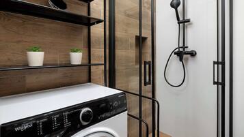 Shower, hair dryer, towels, shampoo