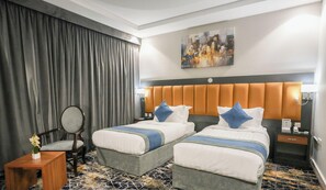 Deluxe Twin kamer | Luxe beddengoed, bedden met traagschuimmatras, een kluis op de kamer