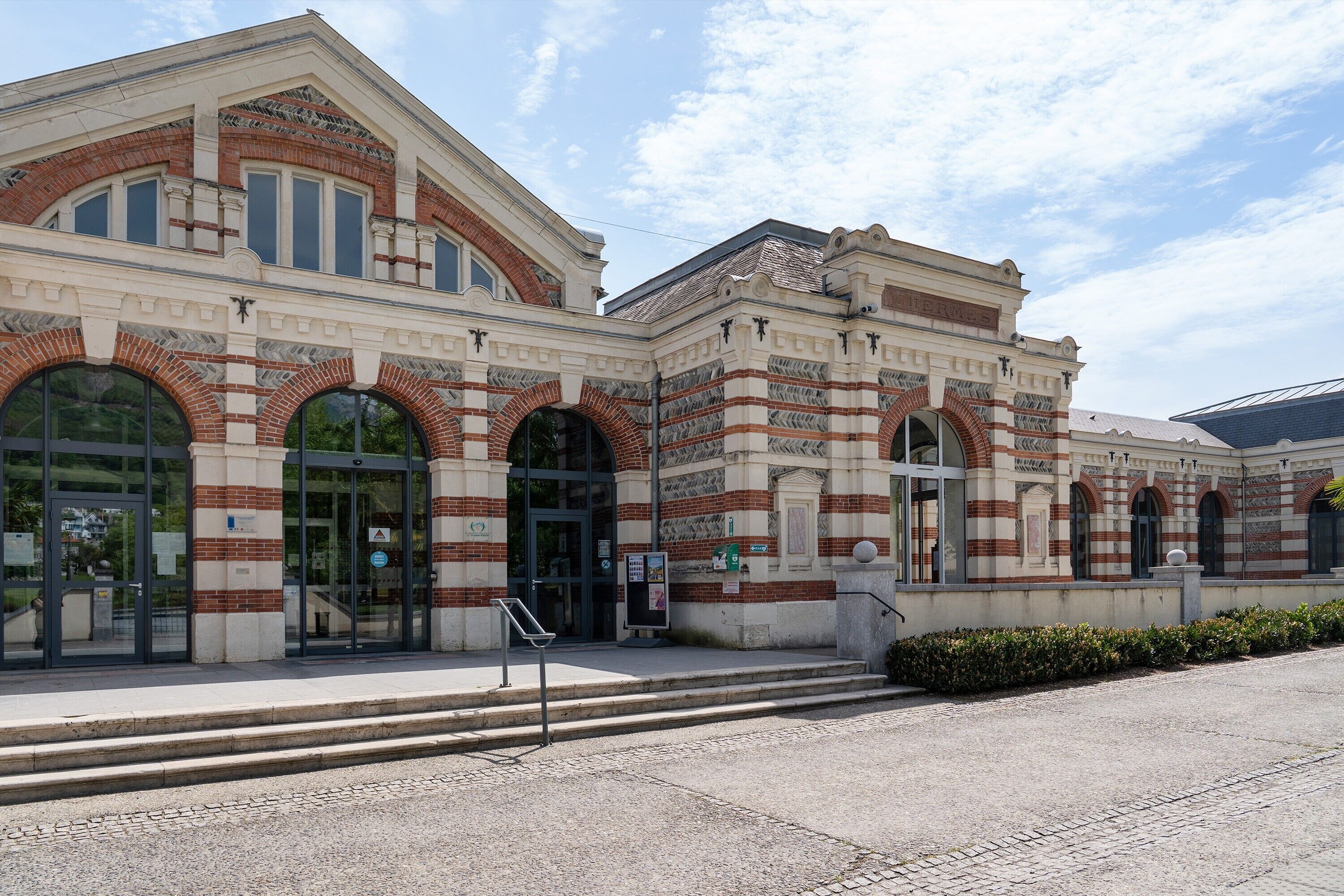 A historic building with arched windows and a brick facade.