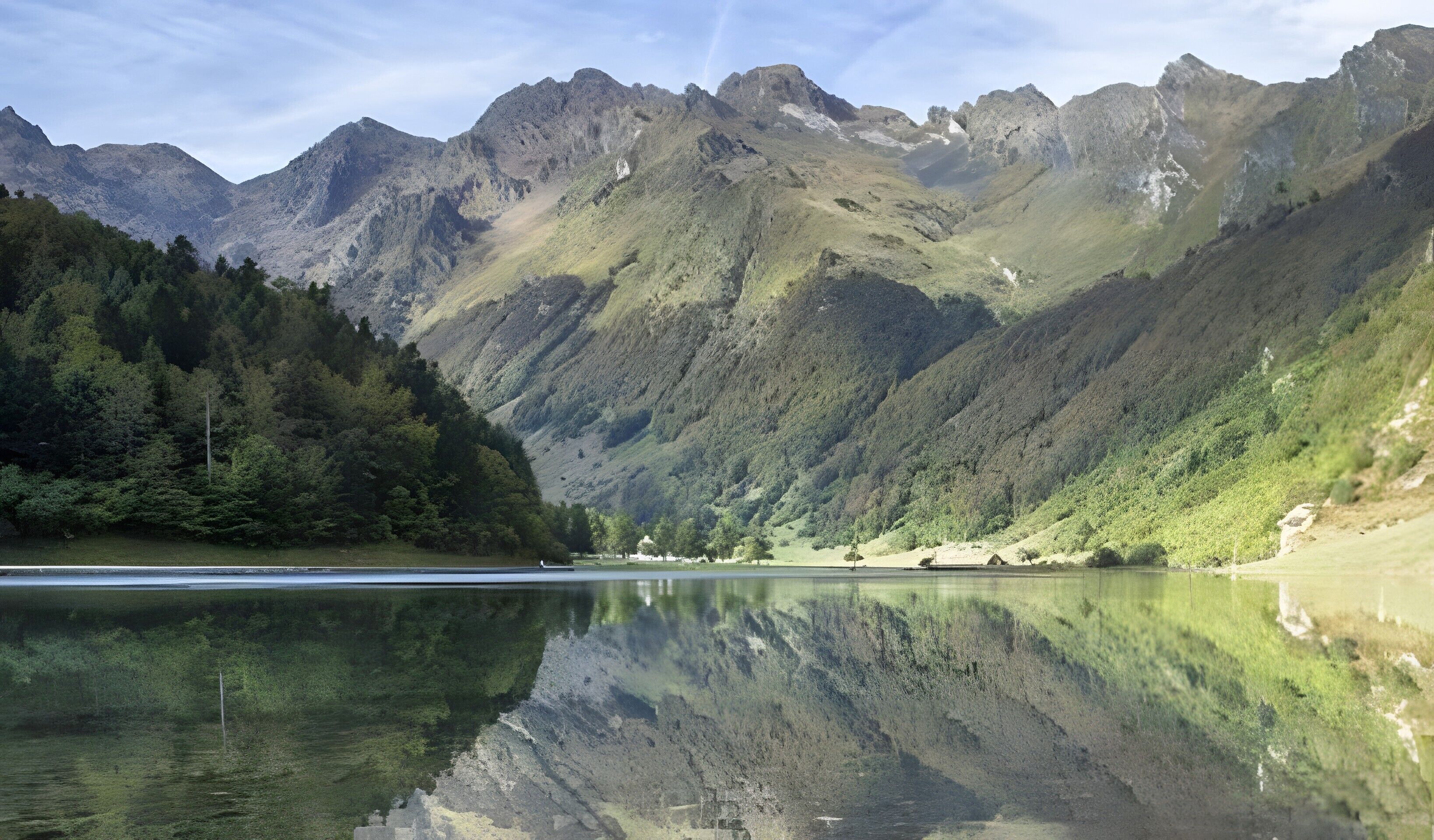 A mountain landscape with a lake reflecting the scenery.