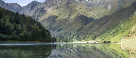 A mountain landscape with a lake reflecting the scenery.