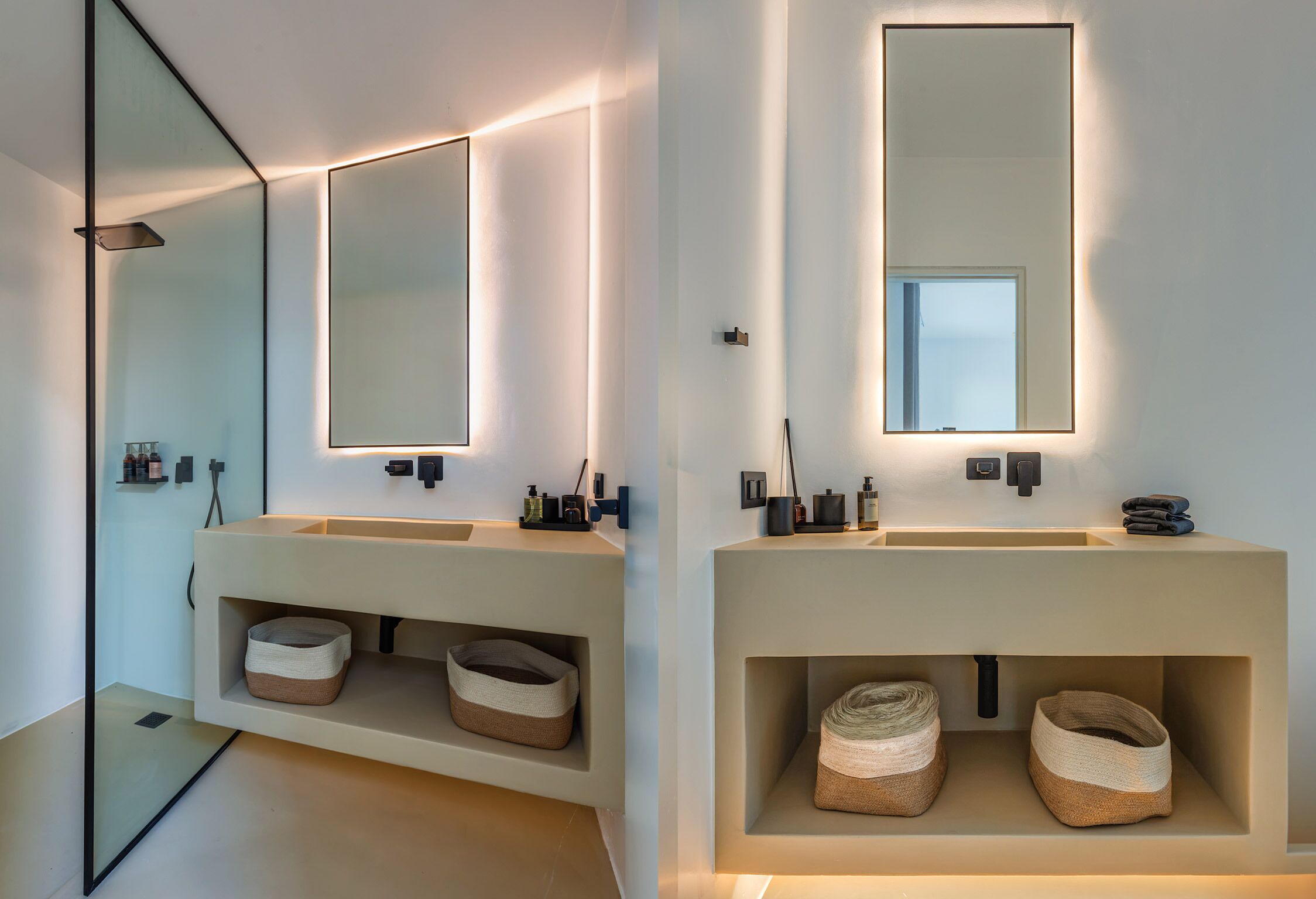 Ein modernes Badezimmer mit zwei Waschbecken, jeweils mit Spiegel darüber. Unter den Waschbecken befinden sich Aufbewahrungsboxen und zur Linken eine Glasdusche.