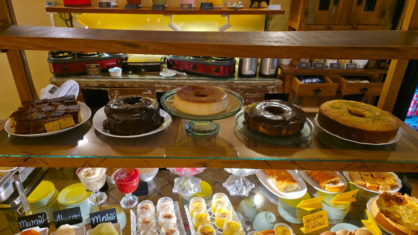 A dessert display with various cakes and pastries.