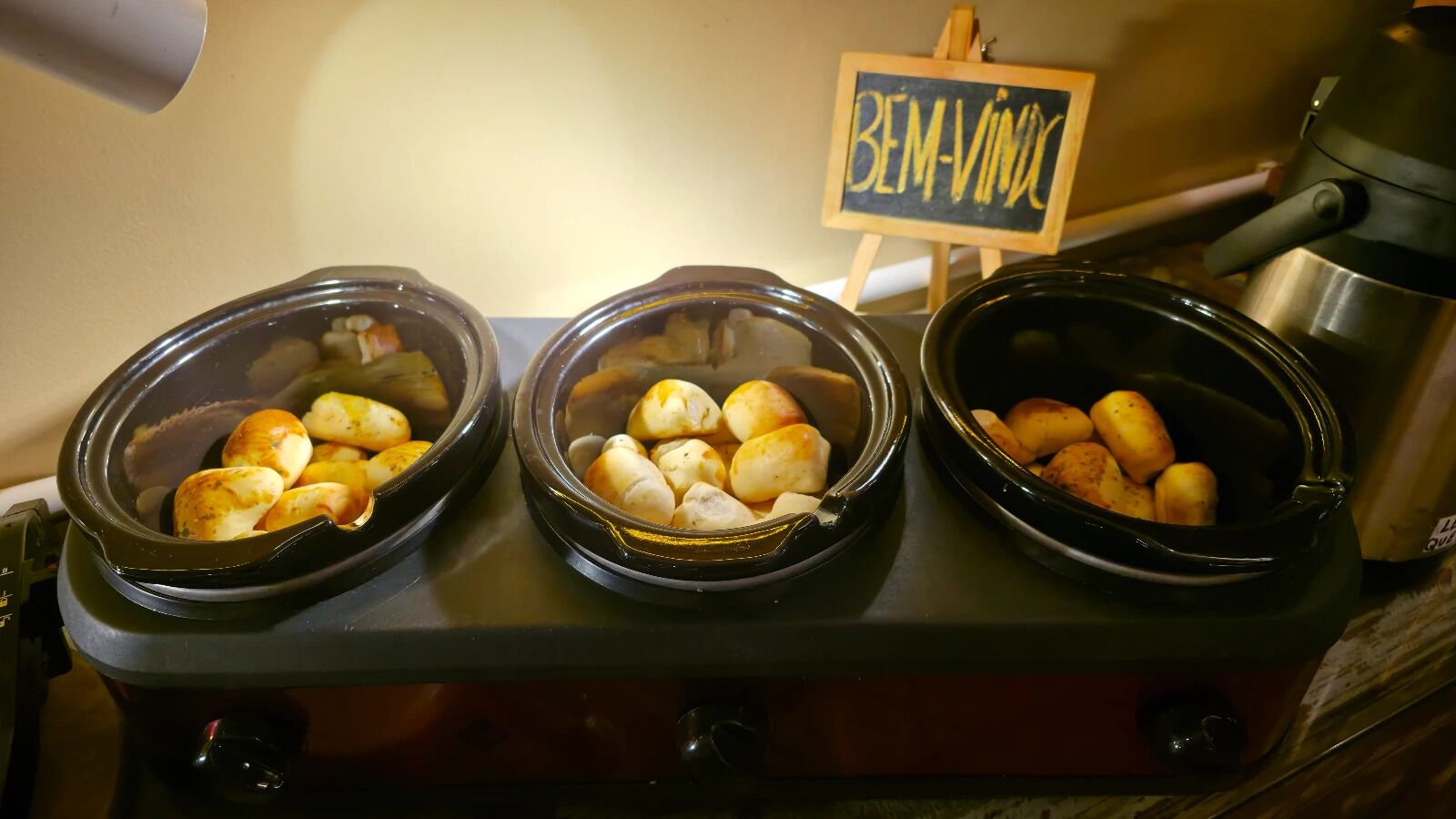 Three slow cooker dishes with different food items.