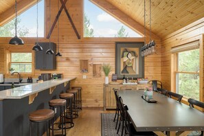 Dining - A modern log cabin with mountain views, hot tub, fire pit, vaulted great room. (Bailey)