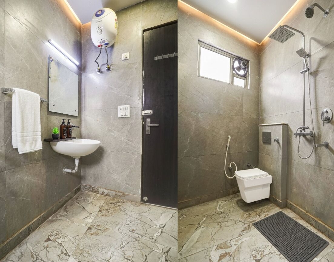 A bathroom with a sink, toilet, and shower.
