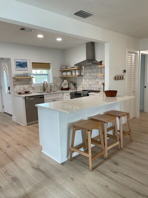 Fridge, microwave, oven, stovetop - Waterfront Escape - Beach + Golf Cart + Family Memories - Indian Rocks Beach, FL (Indian Rocks Beach)
