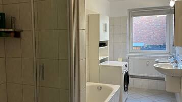 Shower, hair dryer, towels