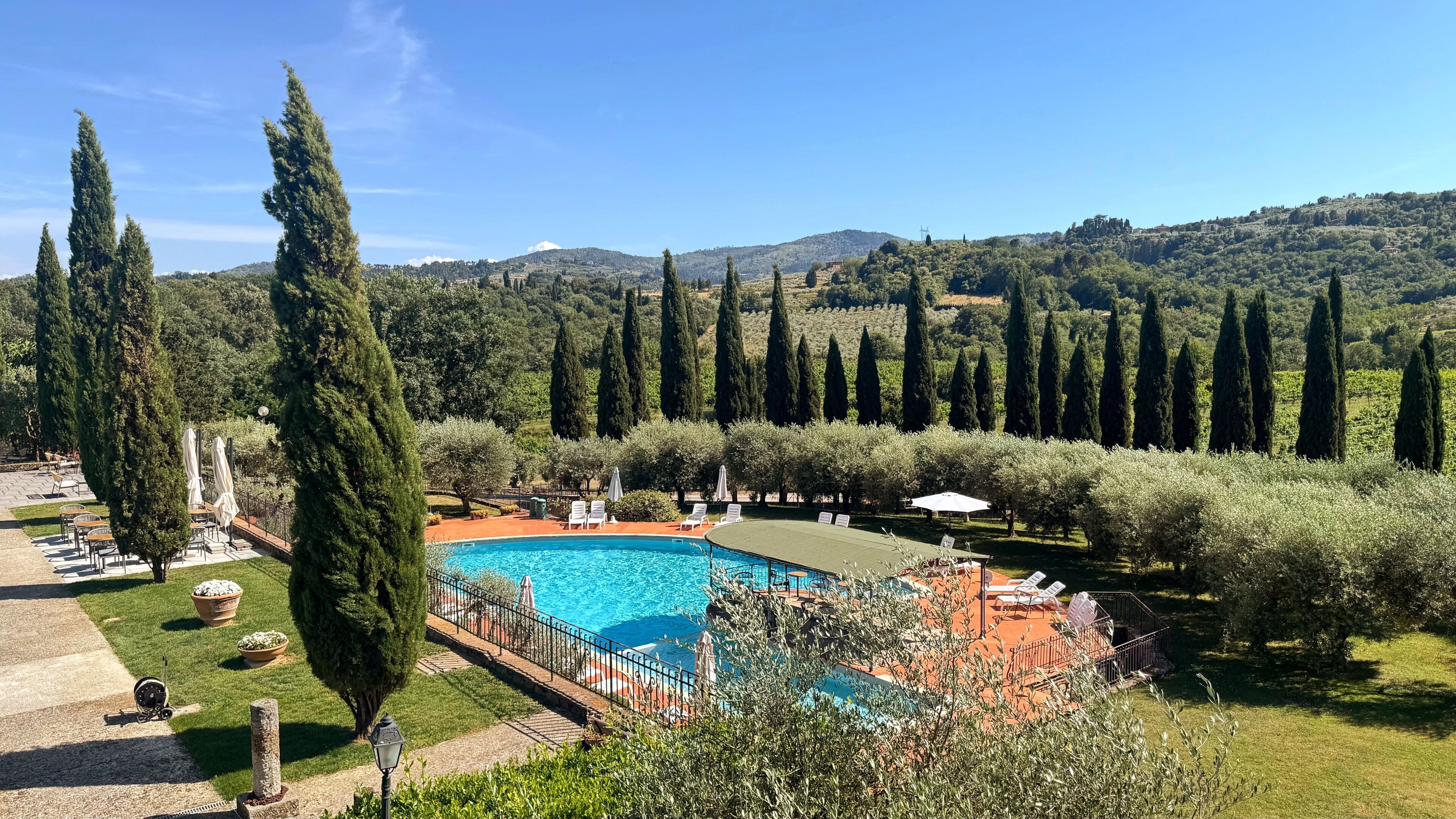 Seasonal outdoor pool, open 9:00 AM to 8:00 PM, pool umbrellas