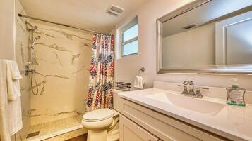 Shower, towels, soap, toilet paper