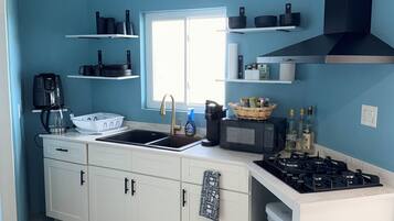Fridge, microwave, stovetop, coffee/tea maker