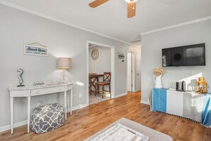 TV, books - Coco Cottage: Dog-Friendly Bungalow in Quiet, Walkable Neighborhood (Oak Island)