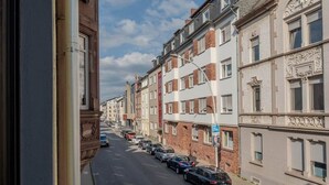 A row of townhouses with a street in between. - Holiday apartment | 2 bedrooms | Sauna | Terrace (Koblenz)