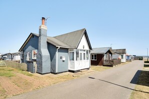 A row of houses with a shared driveway, a chimney, and a small porch. - 3 Bedrooms Sleeps 6 Spacious Chalet Log Burner (Bridlington)