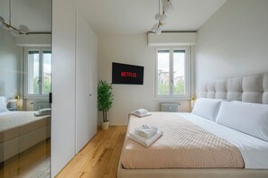 Tabla de planchar con plancha, wifi gratis y ropa de cama 