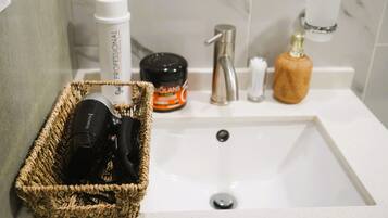 Hair dryer, towels, soap, toilet paper