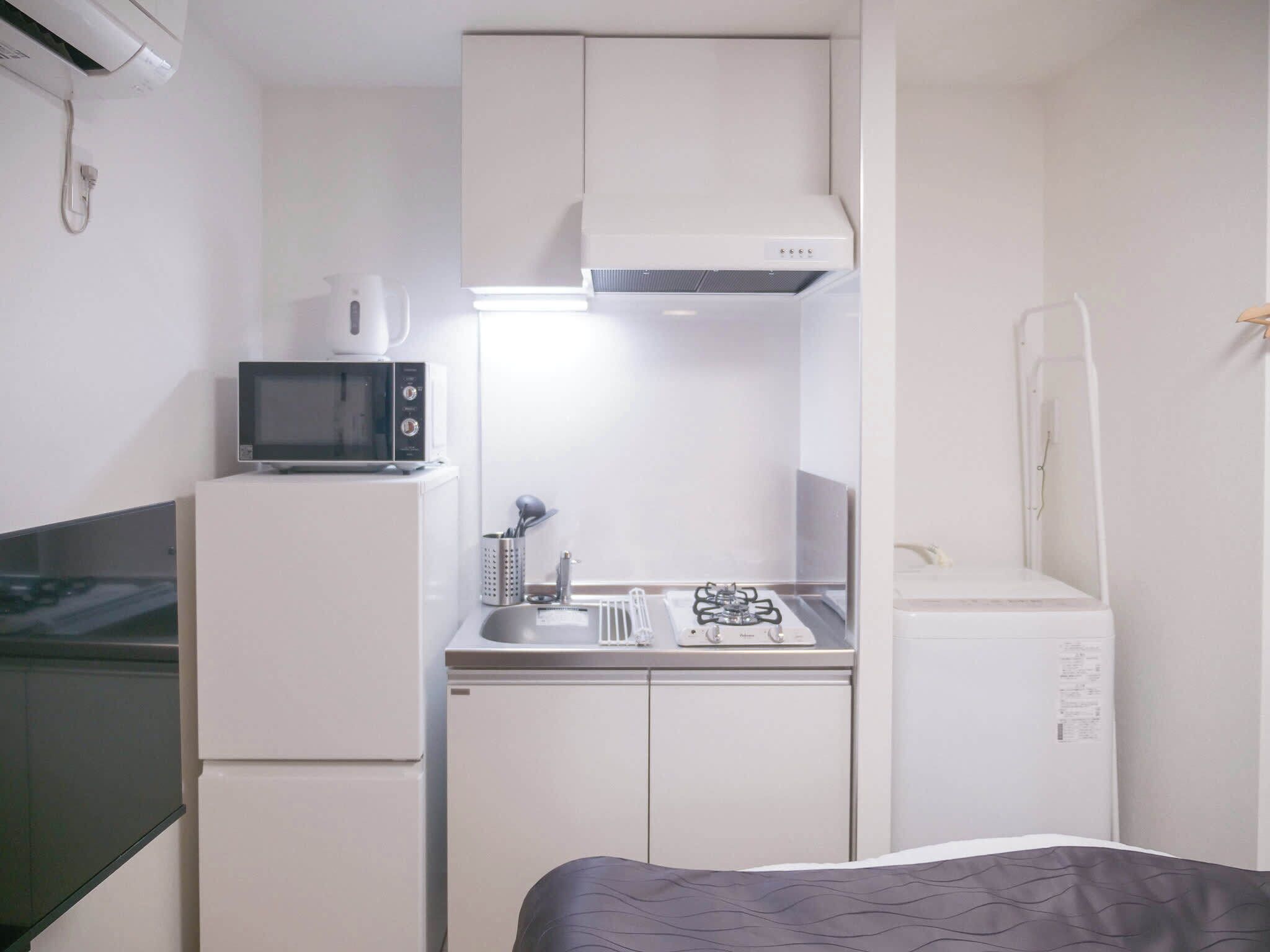 Fridge, microwave, electric kettle, cookware/dishes/utensils