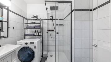Shower, hair dryer, towels, soap