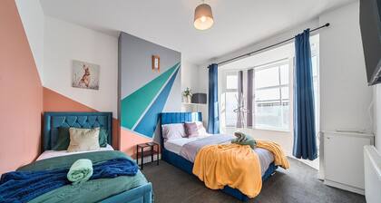 Six‑bedroom stay with garden, private hot tub, parking and easy Manchester tram links