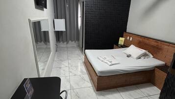 Basic Suite, Air conditioning, Garden View | Minibar, desk, laptop workspace, free WiFi