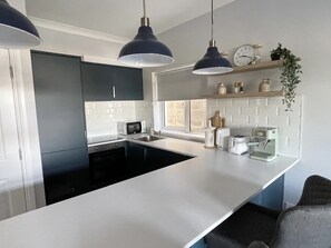 Fridge, microwave, dishwasher, coffee/tea maker