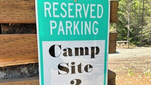 A sign indicating reserved parking for Camp Site 2. - Resurrection Campsite #2 (Hope)