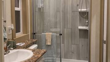 Shower, towels, soap, toilet paper