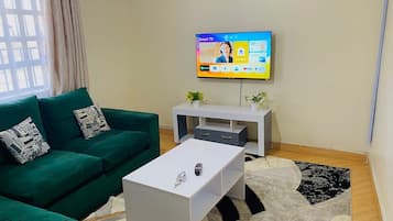 Family Apartment | Living area | 32-inch Smart TV with digital channels