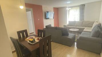 Family Apartment | Living area | 32-inch Smart TV with digital channels