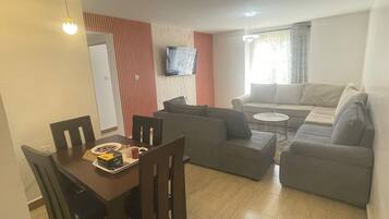 Family Apartment | Living area | 32-inch Smart TV with digital channels