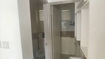 Family Apartment | Bathroom | Shower, free toiletries, slippers, towels