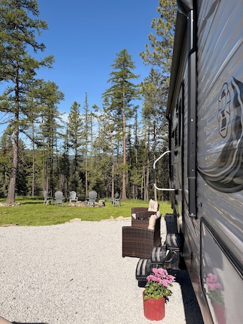 Property grounds. Cozy Camper Retreat In Charming Kalispell 1 Bed + Bunks Full Bath & Kitchen