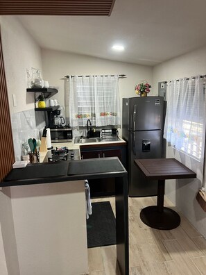 Fridge, microwave, stovetop, coffee/tea maker