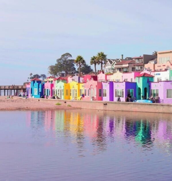 A row of colorful houses along a waterfront. - East Cliff Nook (Santa Cruz)