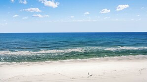 A beach with clear blue water and a sandy shore. - Beach & Gulf front Unit 1003 at Princess Condos 6415 Thomas Drive (Panama City Beach)