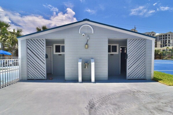 A single-story building with a gabled roof, two doors, and a small window. - B 11 Sundown Condominiums (Pensacola)