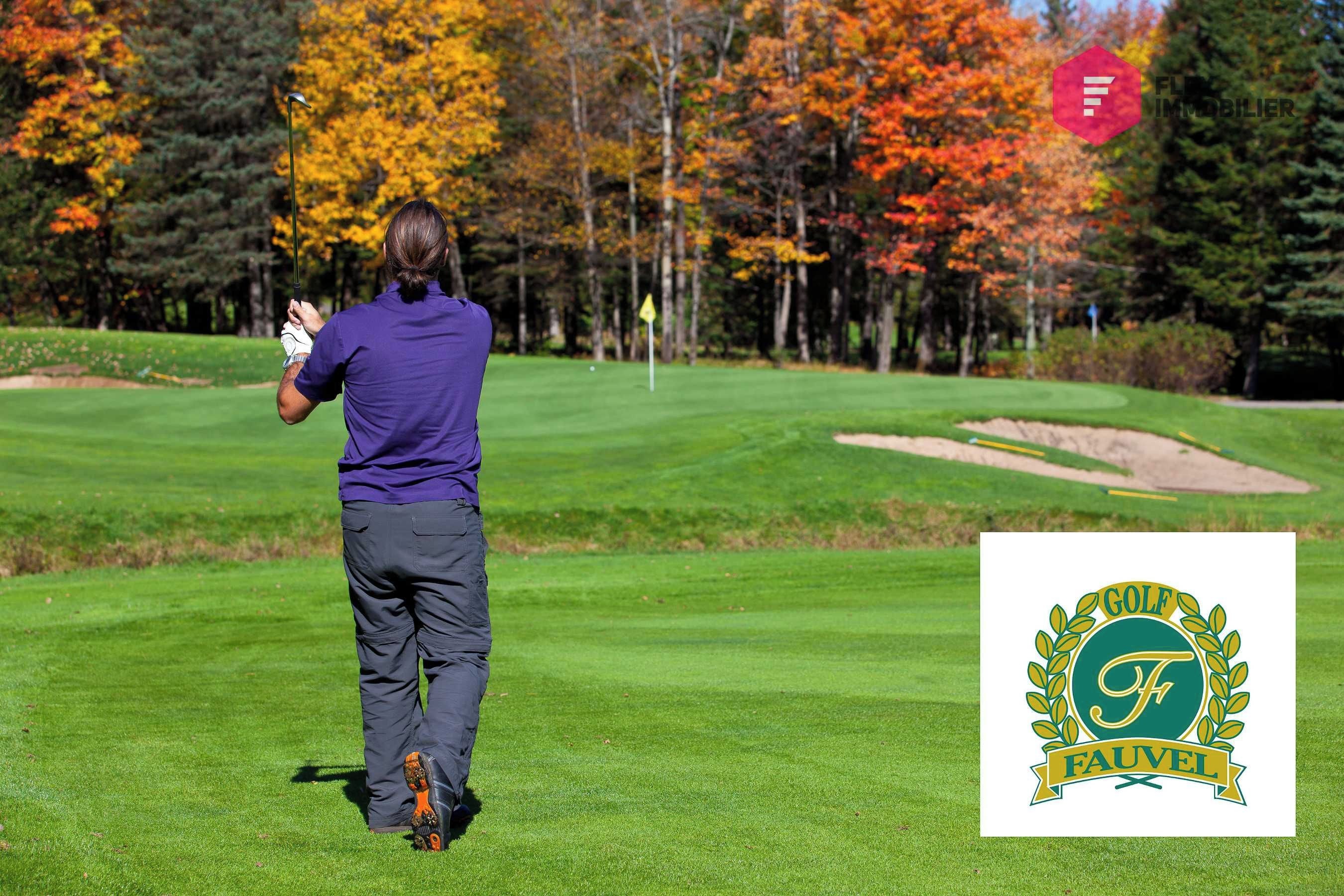 A golf course with a logo in the bottom right corner.