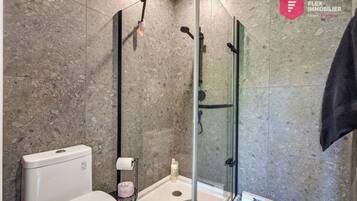 Shower, hair dryer, towels, shampoo