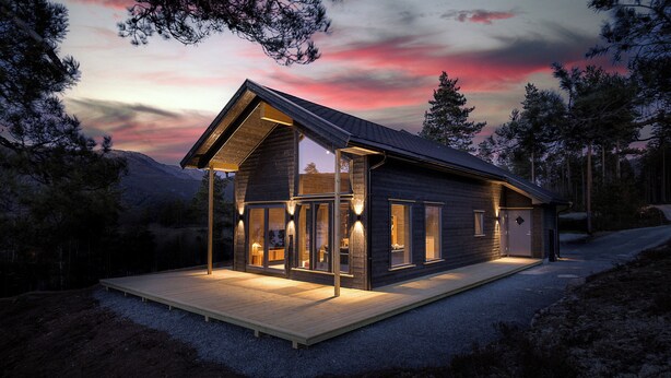 Une cabane moderne dotée d’une terrasse en bois, de grandes fenêtres et d’un espace véranda.