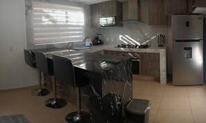 Microwave, oven, coffee/tea maker, cookware/dishes/utensils