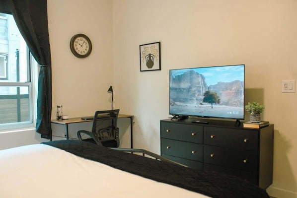 1 bedroom, desk, iron/ironing board, travel crib