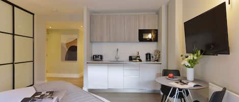 1 bedroom, desk, iron/ironing board, travel crib