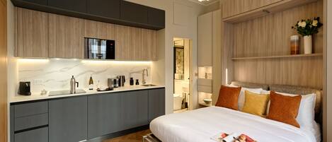 1 bedroom, desk, iron/ironing board, travel crib