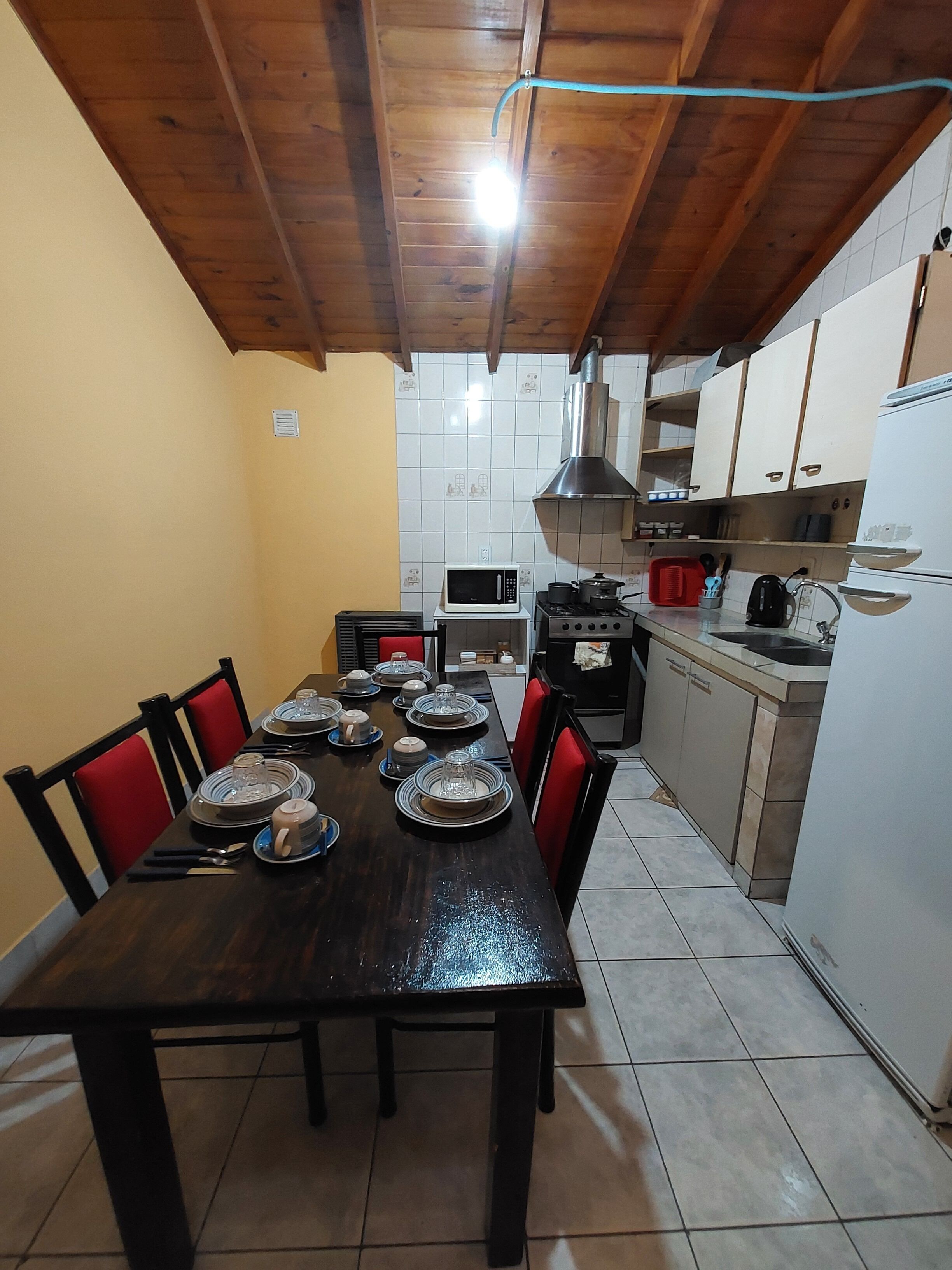 Fridge, microwave, coffee/tea maker, cookware/dishes/utensils