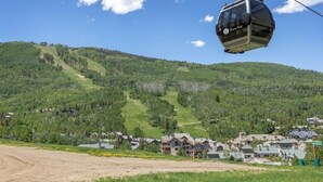 A cable car system with a mountainous backdrop and a small settlement below. - DON'T MISS THIS TRUE SKI IN/SKI OUT VILLAGE GEM, PRIME LOCATION, SLEEPS 5 (Beaver Creek)