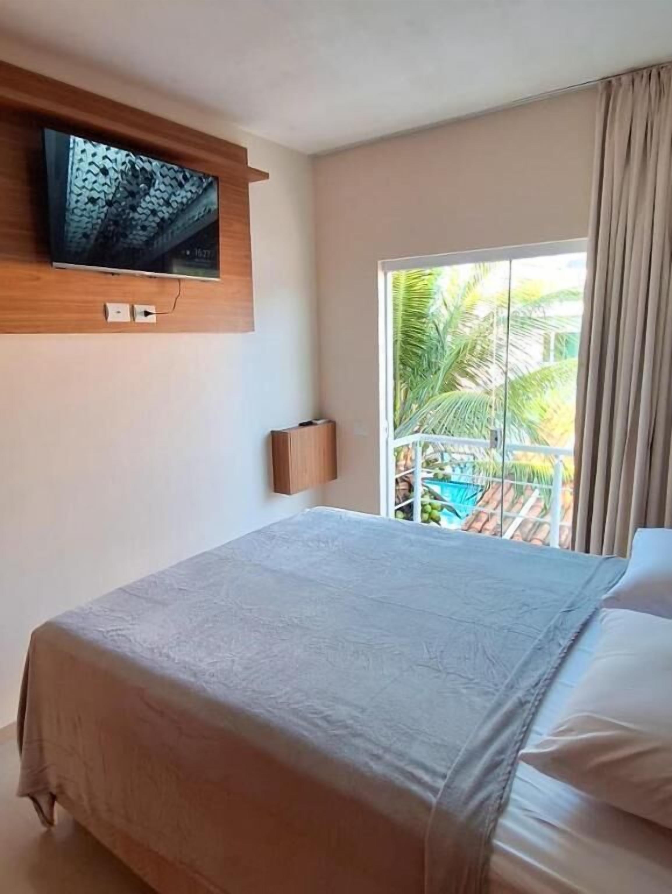 Apartemen Comfort, balkon, pemandangan halaman | Tirai kedap cahaya, setrika/meja setrika, dan Wi-Fi gratis